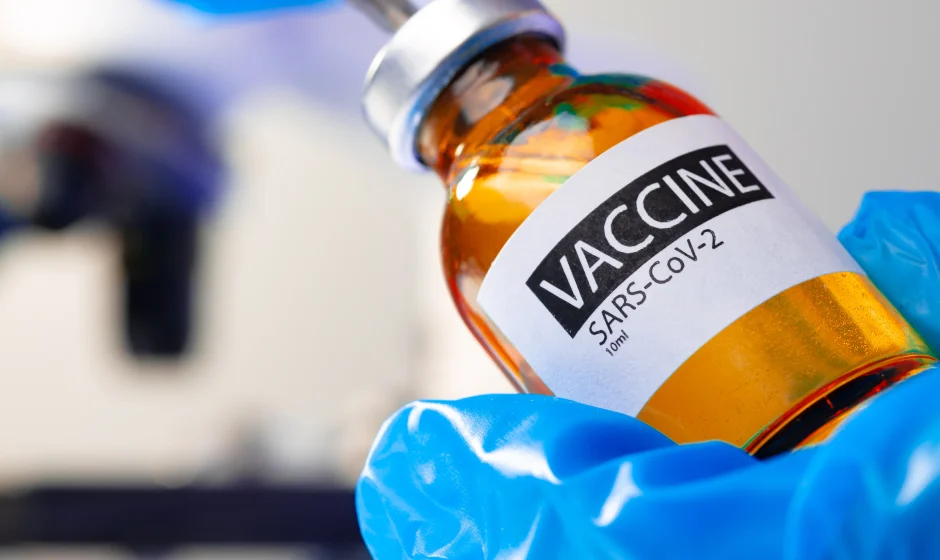 COVID-19 vaccine bottle representing South Africa travel vaccination requirements